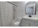 Well-lit bathroom featuring a shower-tub combo and vanity with a framed mirror at 312 Oak Track Ter, Ocala, FL 34472