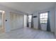Spacious bedroom featuring modern vinyl floors, neutral paint, and two large windows at 312 Oak Track Ter, Ocala, FL 34472