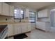 Bright kitchen featuring white cabinets, butcher block countertops, modern appliances, and updated vinyl floors at 312 Oak Track Ter, Ocala, FL 34472