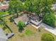 Lush aerial view of a home with a charming red treehouse and mature landscaping at 3205 Clewiston St, Deltona, FL 32738