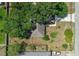 Directly above view of a well-kept property with mature tree coverage and classic landscaping at 3205 Clewiston St, Deltona, FL 32738