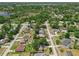 Aerial shot of a charming neighborhood with a mix of housing styles and natural water views at 3205 Clewiston St, Deltona, FL 32738