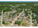 Wide aerial perspective of a residential area, highlighting verdant landscaping and community layout at 3205 Clewiston St, Deltona, FL 32738
