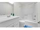 Bathroom with a white vanity, toilet, and tub/shower combination at 3205 Clewiston St, Deltona, FL 32738