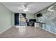 Spacious bedroom with sliding glass doors, custom wall mural, and tile flooring at 3205 Clewiston St, Deltona, FL 32738