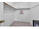 Walk-in closet features neutral walls, tile flooring, and shelving for optimal storage at 3205 Clewiston St, Deltona, FL 32738