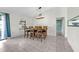 Bright dining room with tile floors, a window, a modern chandelier, and seating for six at 3205 Clewiston St, Deltona, FL 32738