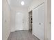 Bright entryway with tile flooring, closet and white front door, creating a welcoming first impression at 3205 Clewiston St, Deltona, FL 32738
