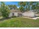 Charming single-story home with a well-manicured lawn and attached two car garage at 3205 Clewiston St, Deltona, FL 32738
