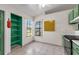 Well-lit kitchen nook area with a green open shelf, corner windows, and tiled floors at 3205 Clewiston St, Deltona, FL 32738