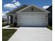 Charming one-story home featuring a two-car garage and well-maintained landscaping at 3449 Briarwood Grove Dr, Ocoee, FL 34761