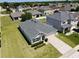Wide shot of a home showing its well-maintained lawn, modern roof, and proximity to a Gathering-friendly neighborhood at 3702 Maidencain St, Clermont, FL 34714