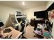 Cozy bedroom with bunk beds, a dresser, and a dedicated workspace for studying or creative projects at 3702 Maidencain St, Clermont, FL 34714