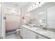 Bathroom featuring double sinks and granite countertops with a shower/tub combo at 416 Southfield St, Kissimmee, FL 34747