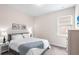 Bedroom with neutral walls, carpet, and a window for natural light at 416 Southfield St, Kissimmee, FL 34747