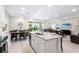 Open-concept kitchen features a large island and stainless steel appliances at 416 Southfield St, Kissimmee, FL 34747