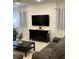Cozy living room with a TV, shiplap wall, and comfortable seating at 416 Southfield St, Kissimmee, FL 34747