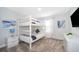 Comfortable bedroom featuring a bunk bed, neutral tones, and plenty of space at 4188 Paragraph Dr, Kissimmee, FL 34746