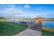 Community lake with a dock, gazebo, and waterfront access at 4188 Paragraph Dr, Kissimmee, FL 34746