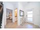 Bright entryway featuring a modern table, decorative mirror, and views of the bedroom and bathroom at 4188 Paragraph Dr, Kissimmee, FL 34746