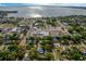 Scenic aerial view highlighting the town's layout near a tranquil lake and lush trees at 420 N Center St, Eustis, FL 32726