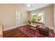 Cozy bedroom with a daybed, area rug, and natural light from the window at 420 N Center St, Eustis, FL 32726