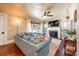 Cozy living room with a brick fireplace, built-in shelves, and a comfortable sectional sofa at 420 N Center St, Eustis, FL 32726
