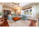 Bright living room featuring hardwood floors, a plush rug, and lots of natural light at 420 N Center St, Eustis, FL 32726
