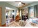 Inviting home office with a swivel chair and view into the comfortable living room at 420 N Center St, Eustis, FL 32726