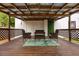 Covered patio with outdoor furniture, a wooden deck, and privacy lattice at 420 N Center St, Eustis, FL 32726