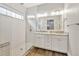 Stylish bathroom features a glass-enclosed shower and double vanity with granite countertops at 441 N Capen Ave, Winter Park, FL 32789