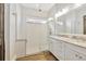 Elegant bathroom with a glass-enclosed shower, double vanity, and granite countertops at 441 N Capen Ave, Winter Park, FL 32789