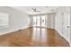 Spacious bedroom with hardwood floors and sliding doors to a private balcony overlooking the neighborhood at 441 N Capen Ave, Winter Park, FL 32789