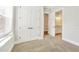 Neutral carpeted bedroom with view to the en suite bathroom and double door closet at 441 N Capen Ave, Winter Park, FL 32789