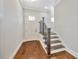 Welcoming foyer with hardwood floors, stairs, and a white front door, offering a bright entrance at 441 N Capen Ave, Winter Park, FL 32789