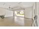 View through garage with epoxy flooring to paved driveway and house beyond at 441 N Capen Ave, Winter Park, FL 32789