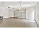 Spacious two-car garage with epoxy flooring, bright lighting, and white walls at 441 N Capen Ave, Winter Park, FL 32789
