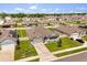 Well-placed home features an attached garage, neat landscaping, and a fenced backyard, sitting in a friendly neighborhood at 445 Auburn Grove Pl, Auburndale, FL 33823