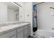 Charming bathroom with dual vanity, granite countertop, and a tub-shower combo, perfect for a Gathering at 445 Auburn Grove Pl, Auburndale, FL 33823