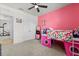 Bright, colorful bedroom featuring a loft bed with play area and good storage space at 445 Auburn Grove Pl, Auburndale, FL 33823