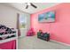 Whimsical bedroom with loft bed, wall-mounted television, and a play kitchen, perfect for any  at 445 Auburn Grove Pl, Auburndale, FL 33823