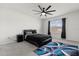Bright bedroom featuring a ceiling fan and a window with black curtains at 445 Auburn Grove Pl, Auburndale, FL 33823