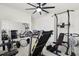 Home gym equipped with weightlifting equipment and a treadmill, enhanced by a full wall mirror to see your progress at 445 Auburn Grove Pl, Auburndale, FL 33823