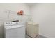 Practical laundry room with washer, dryer, and storage shelf, great for everyday tasks at 445 Auburn Grove Pl, Auburndale, FL 33823