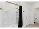 Modern shower with black curtain and white tile at 445 Auburn Grove Pl, Auburndale, FL 33823