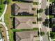 Aerial view showcasing the neighborhood's neat roofs, green lawns, and sidewalk-lined streets at 459 Dancing Water Dr, Winter Springs, FL 32708