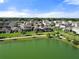 Aerial view of a community with beautiful homes, a pond, and walking paths at 459 Dancing Water Dr, Winter Springs, FL 32708