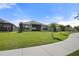 Spacious backyard featuring lush lawn and a covered patio, ideal for relaxation and outdoor activities at 459 Dancing Water Dr, Winter Springs, FL 32708