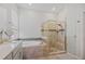 Well-lit bathroom featuring a bathtub and a separate glass-enclosed shower at 459 Dancing Water Dr, Winter Springs, FL 32708