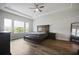 Spacious bedroom featuring a king bed, tray ceiling, and lots of natural light at 459 Dancing Water Dr, Winter Springs, FL 32708